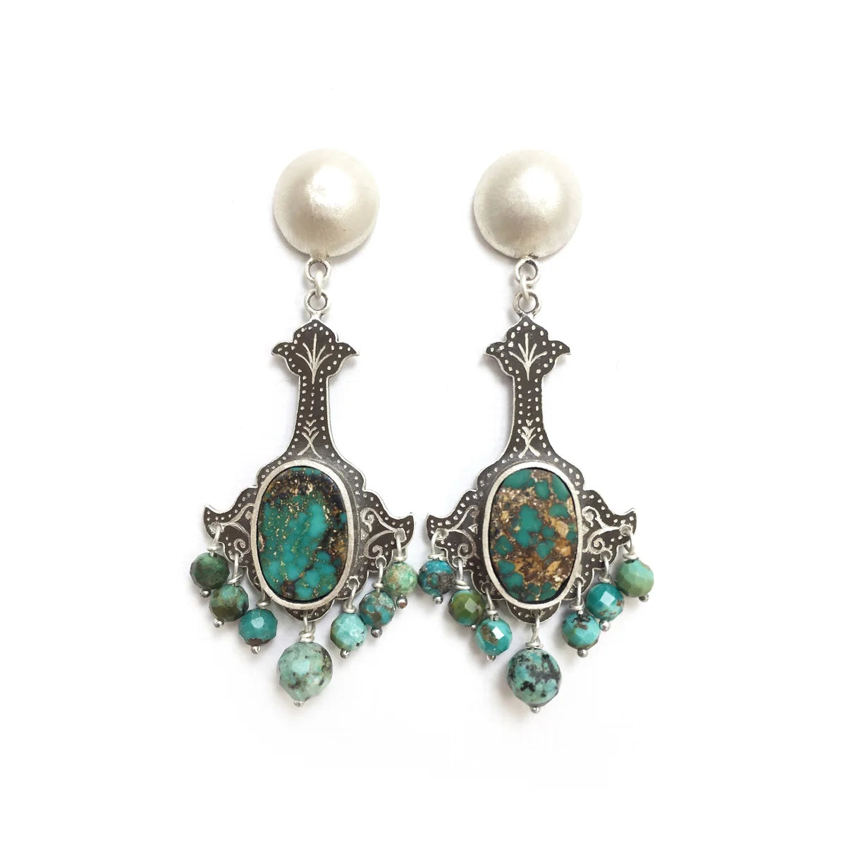 Handmade silver chandelier earrings decorated with turquoise gemstones.