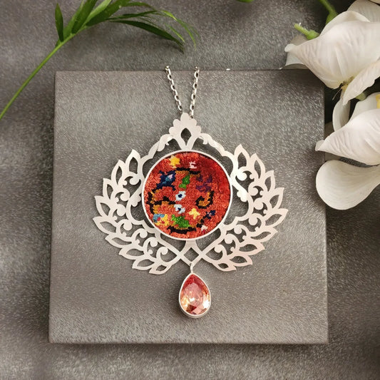 handmade silver necklace with handwoven Persian Rug and red cubic zirconia