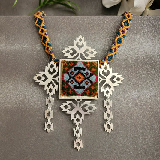 handmade openwork silver statement necklace with green, orange and blue colored Persian rug decoration