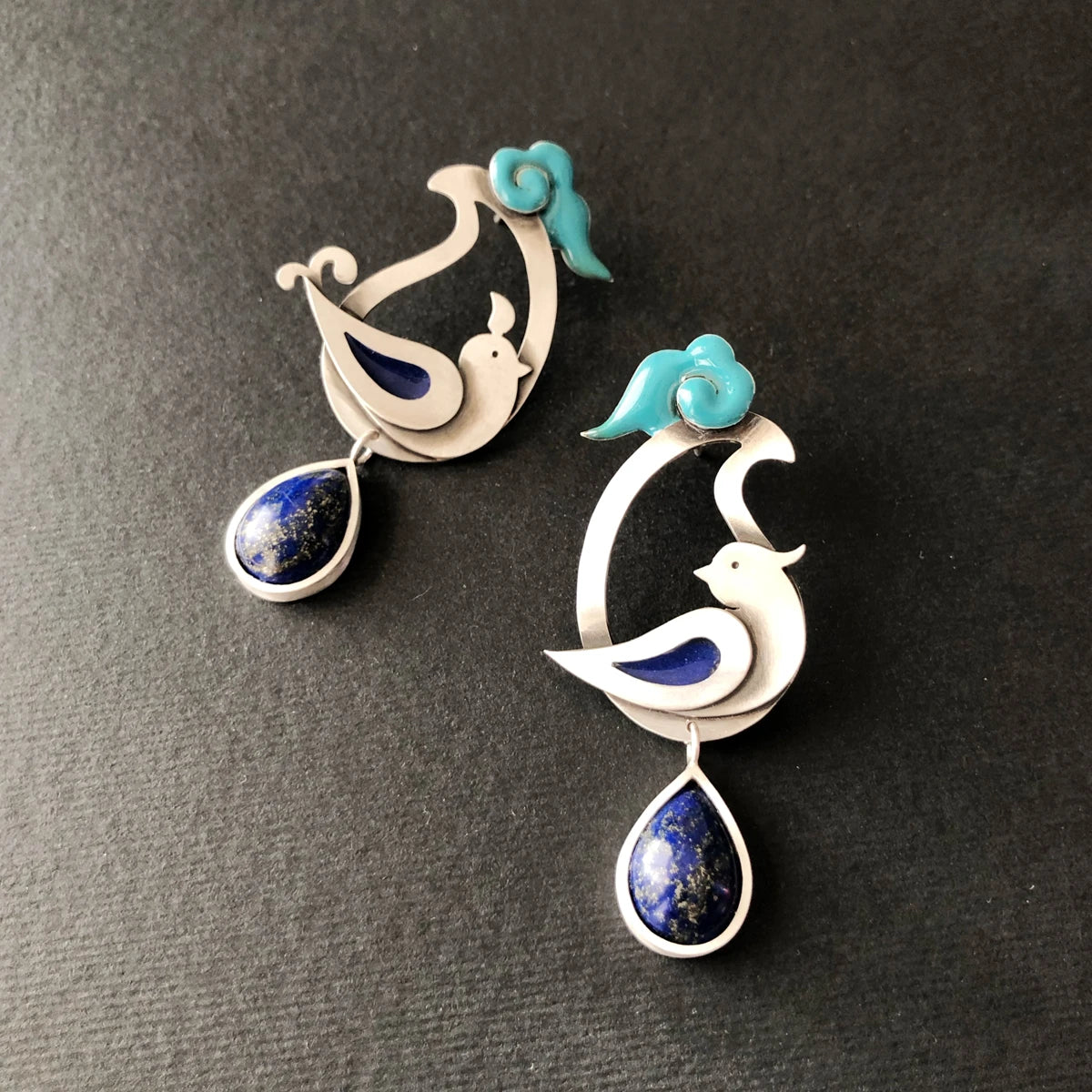 Pair of paisley earrings with bird and cloud design and teardrop lapis lazuli