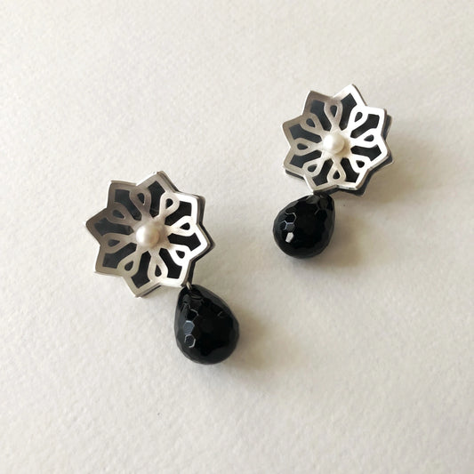 handmade silver star-shaped earrings with pearl and faceted onyx
