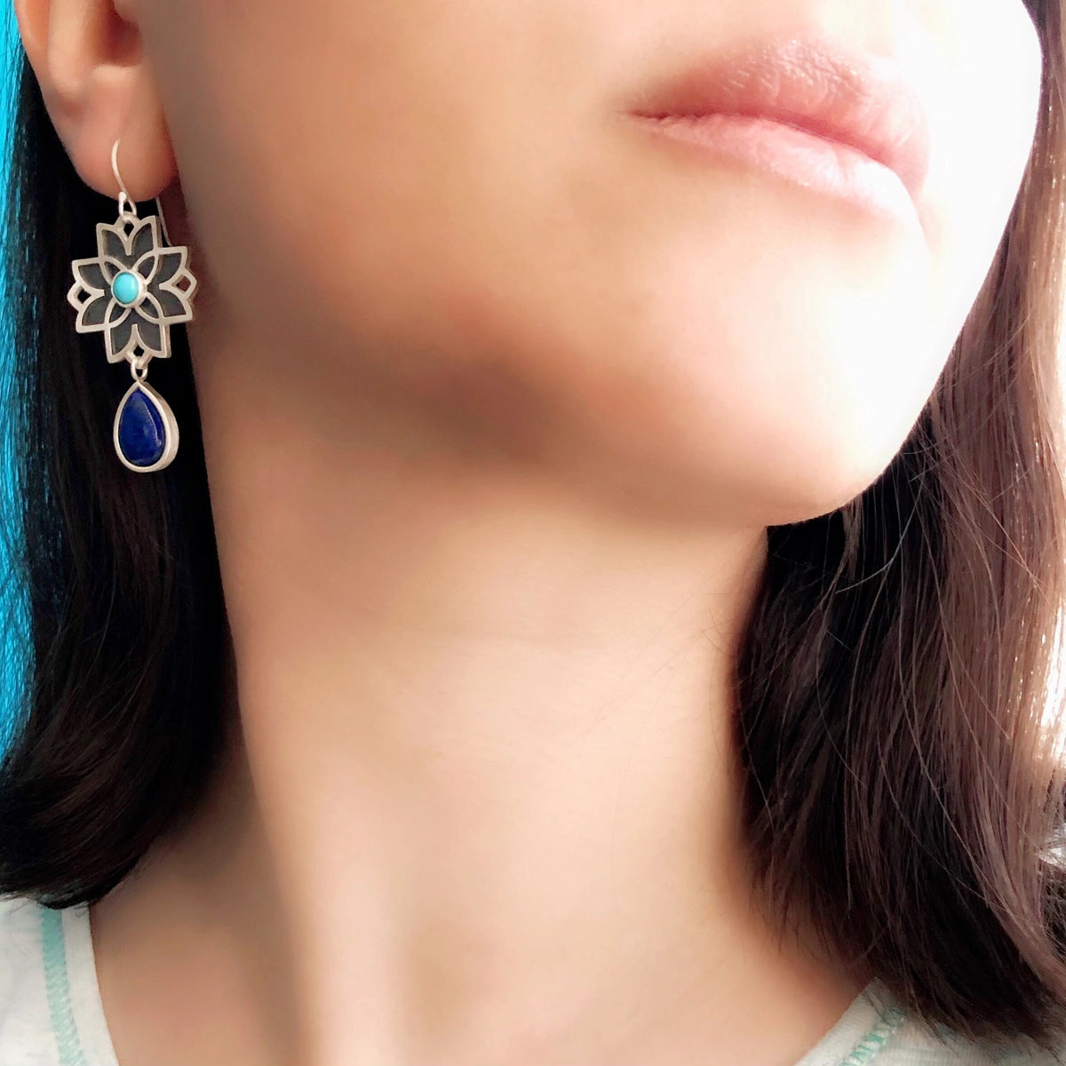model wearing handmade silver drop flower earrings with lapis lazuli & turquoise