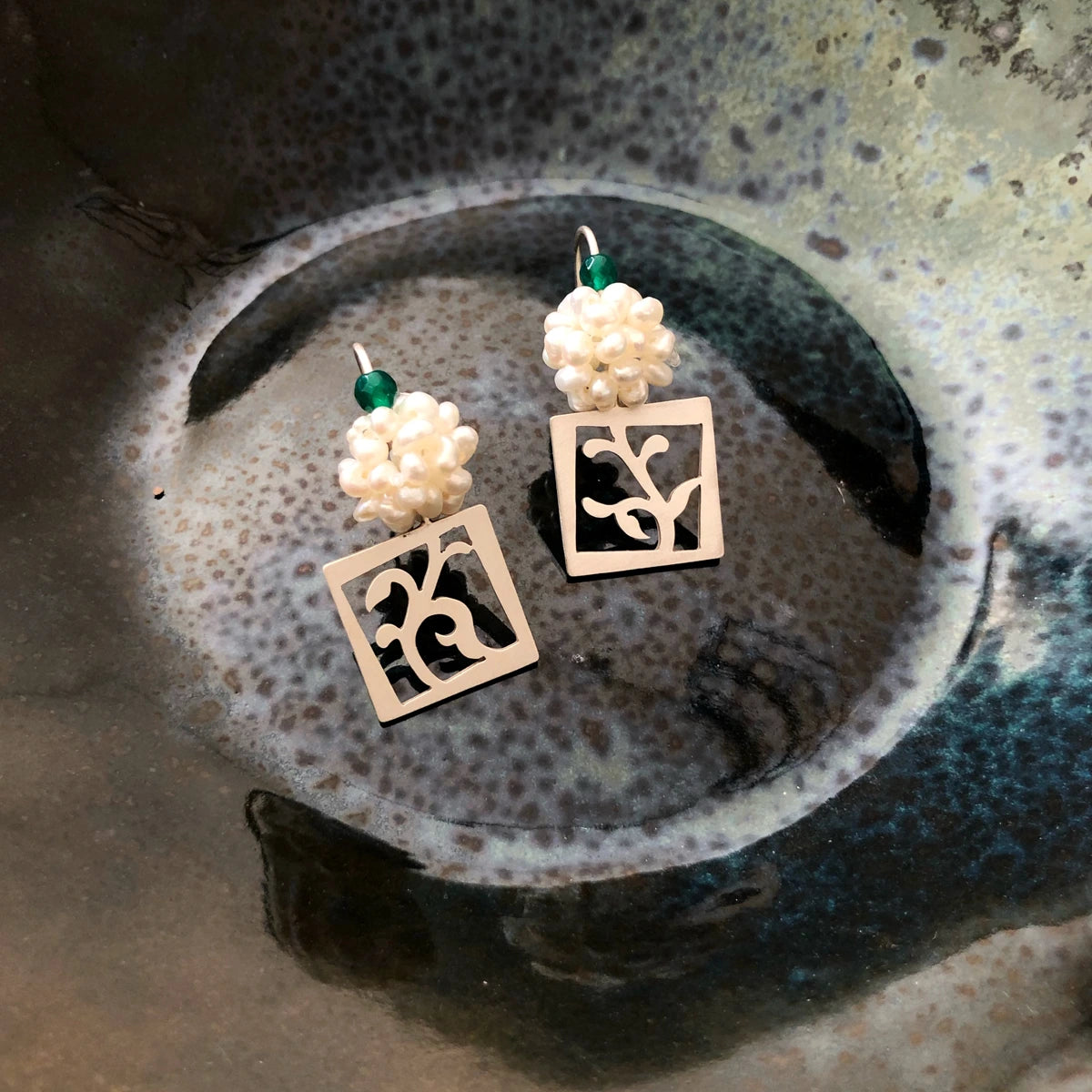 handmade openwork silver floral square drop earrings decorated with a cluster of cultured pearls and green agate