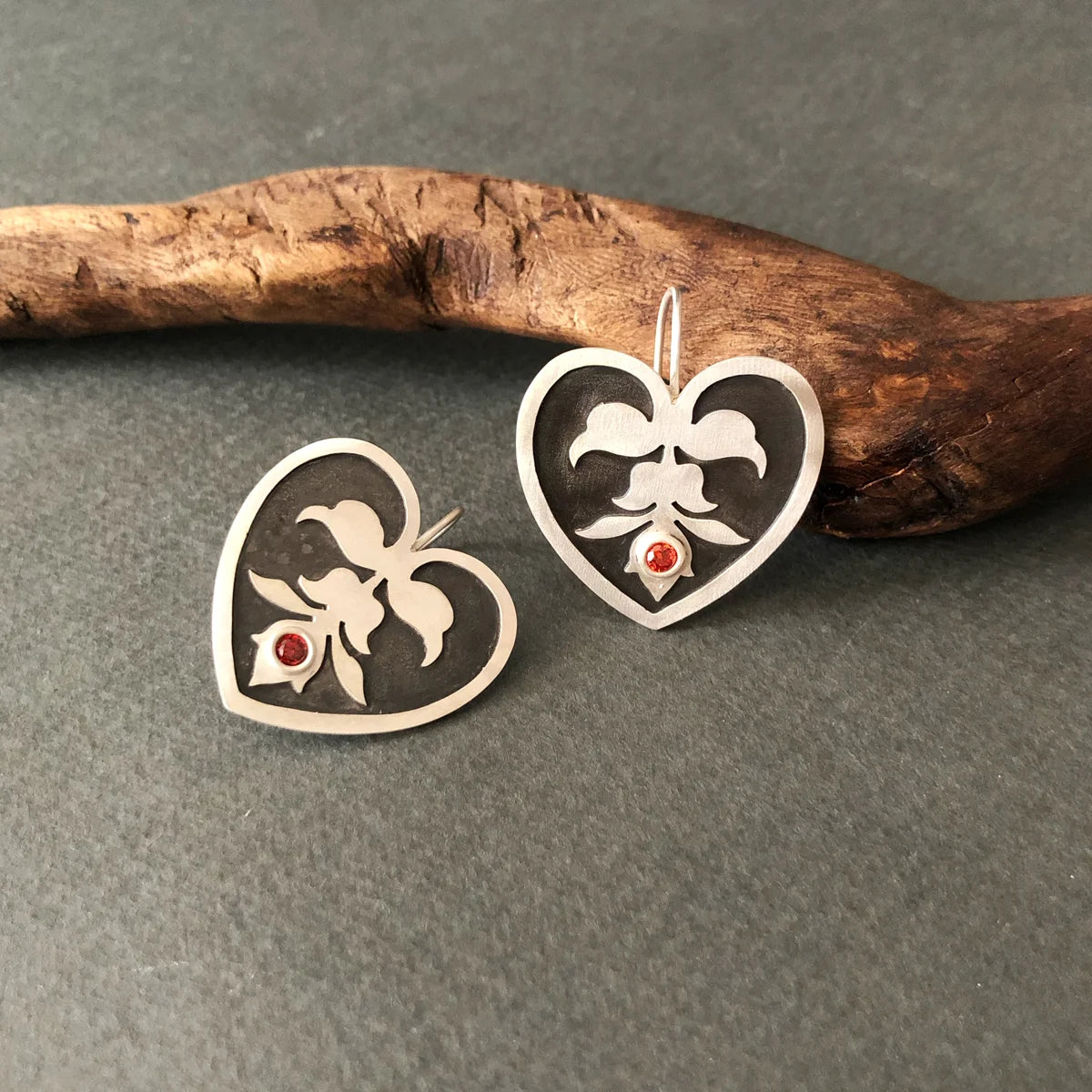 handmade heart-shaped silver earrings with motif and cubic zirconia