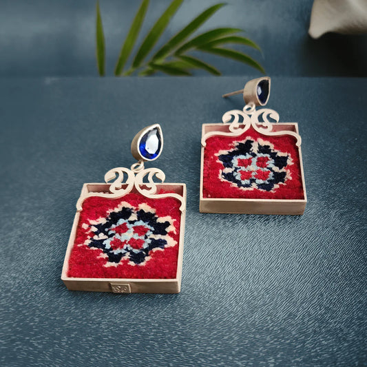handmade silver and Persian rug statement earrings with openwork paisley pattern and blue cubic zirconia