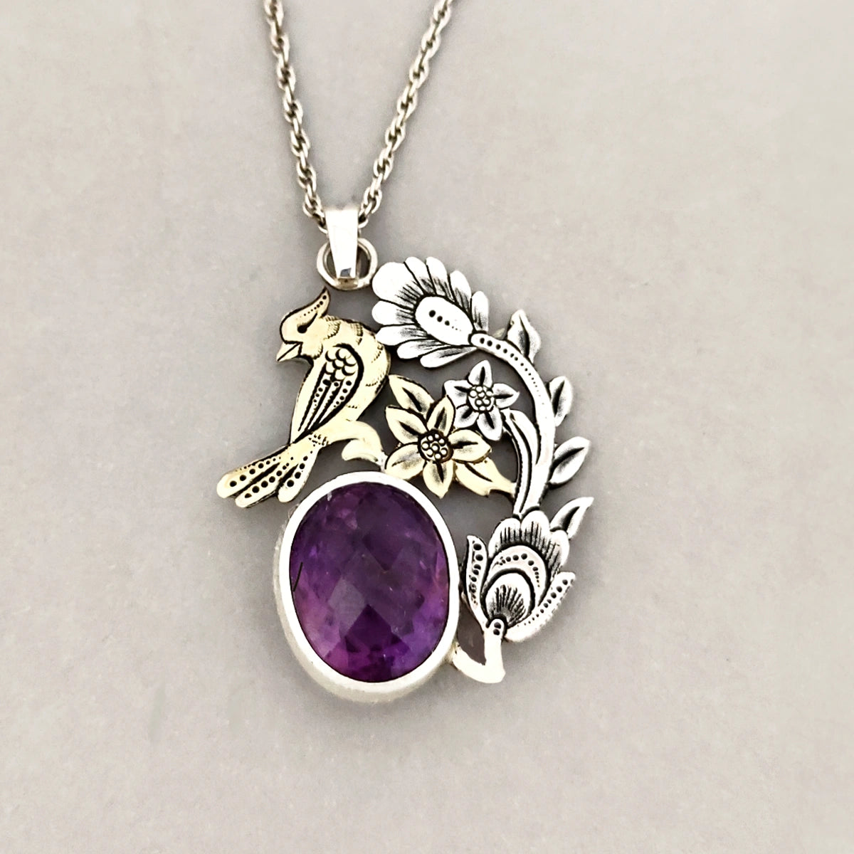 hand-engraved gold plated bird and floral pattern pendant with amethyst