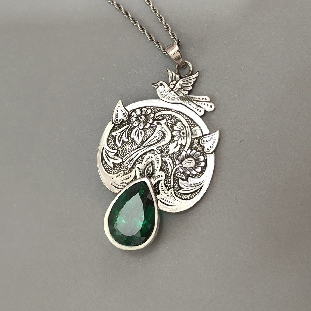 hand-engraved birds in a garden silver pendant necklace with green topaz