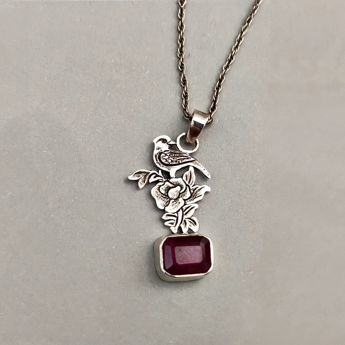 hand-engraved handmade bird on a rose silver pendant necklace with ruby