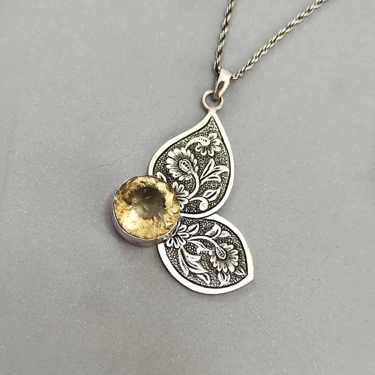 hand-engraved silver butterfly pendant necklace decorated with citrine