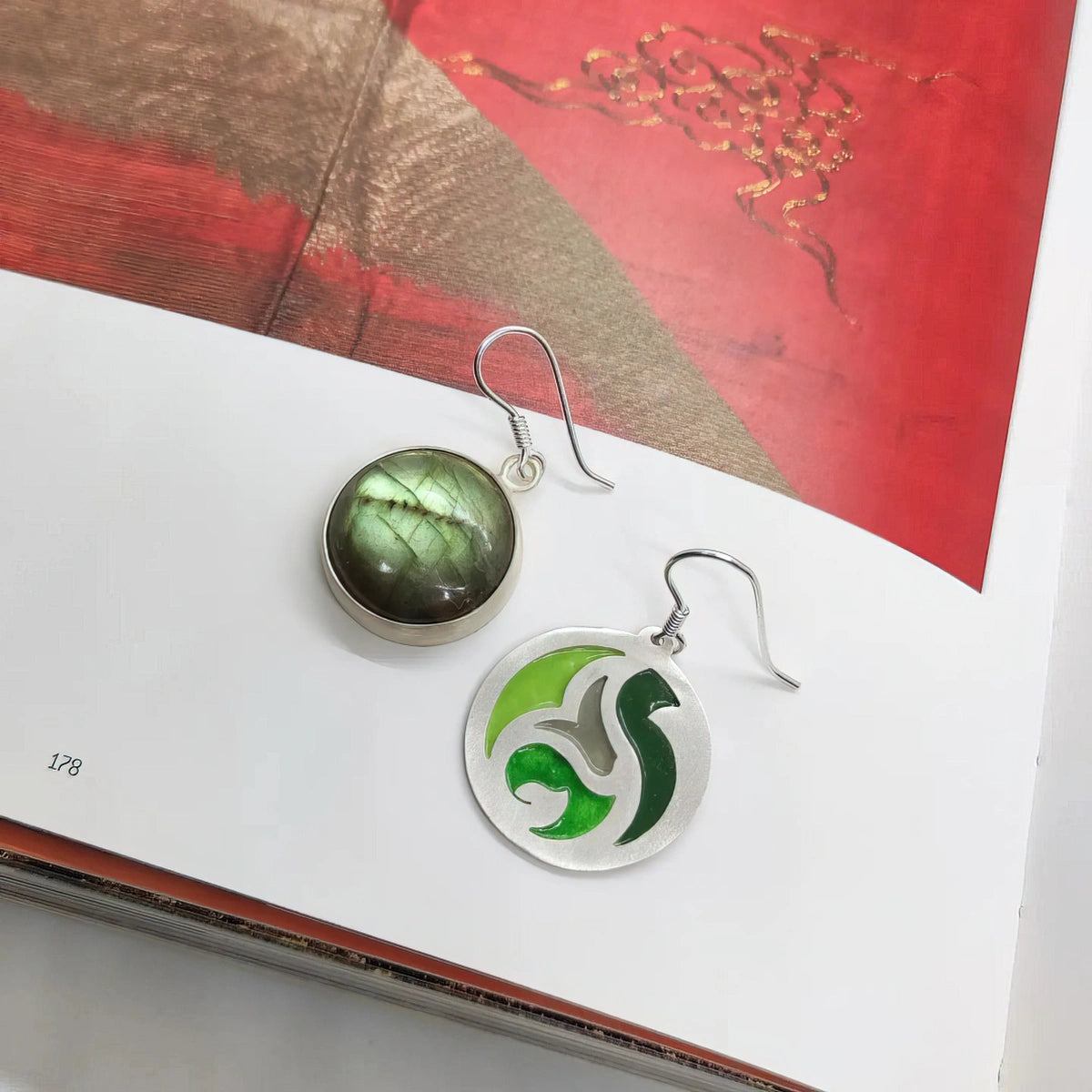 handmade circular mismatched silver and enamel earrings decorated with green labradorite