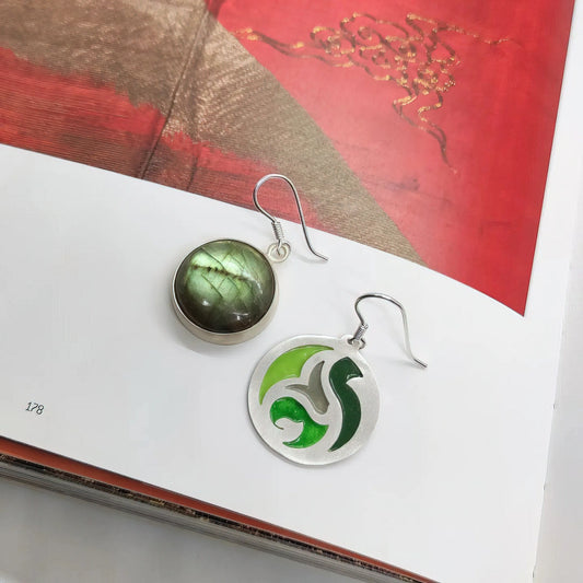handmade circular mismatched silver and enamel earrings decorated with green labradorite