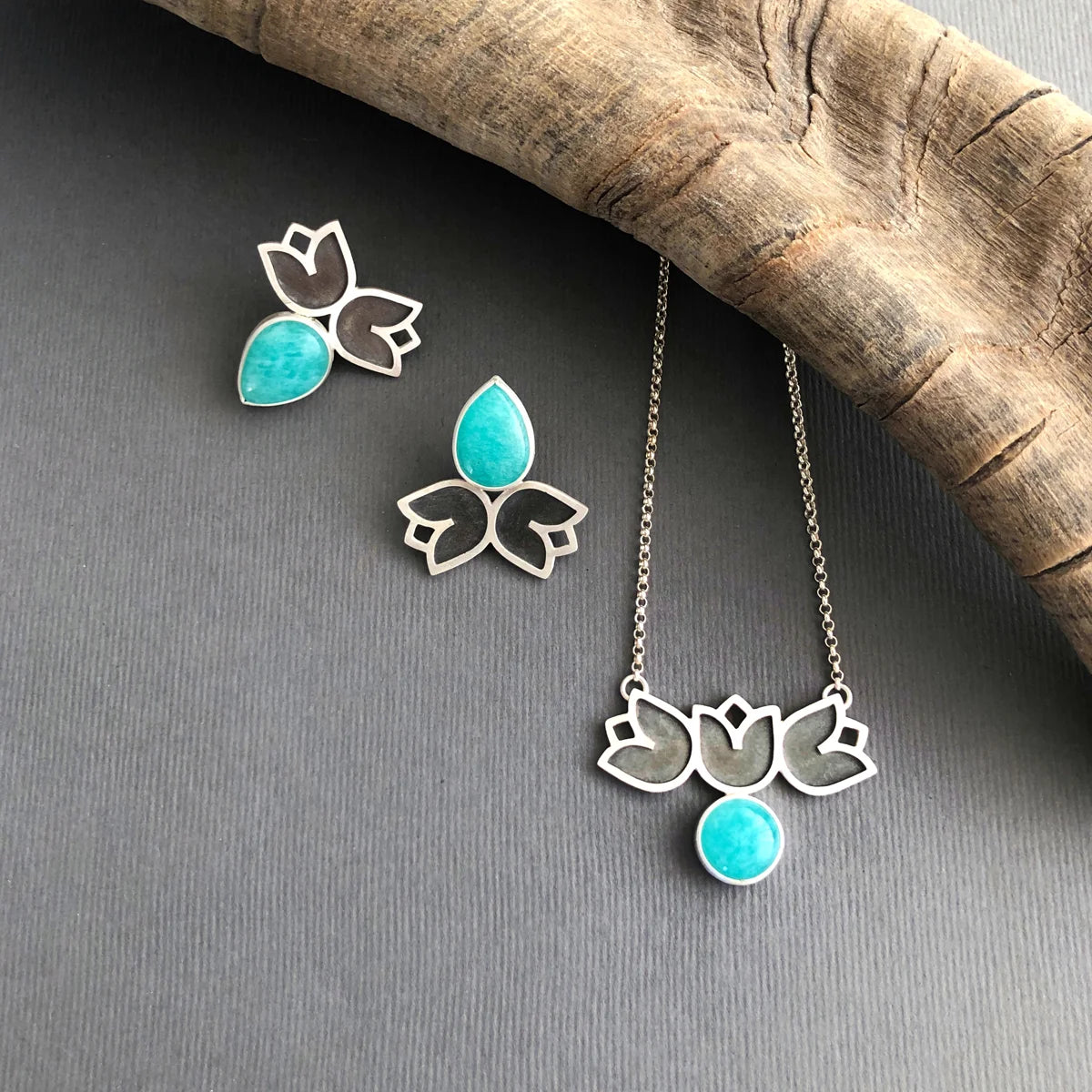 set of handmade mismatched stud earrings decorated with flowers and teardrop amazonite and matching necklace