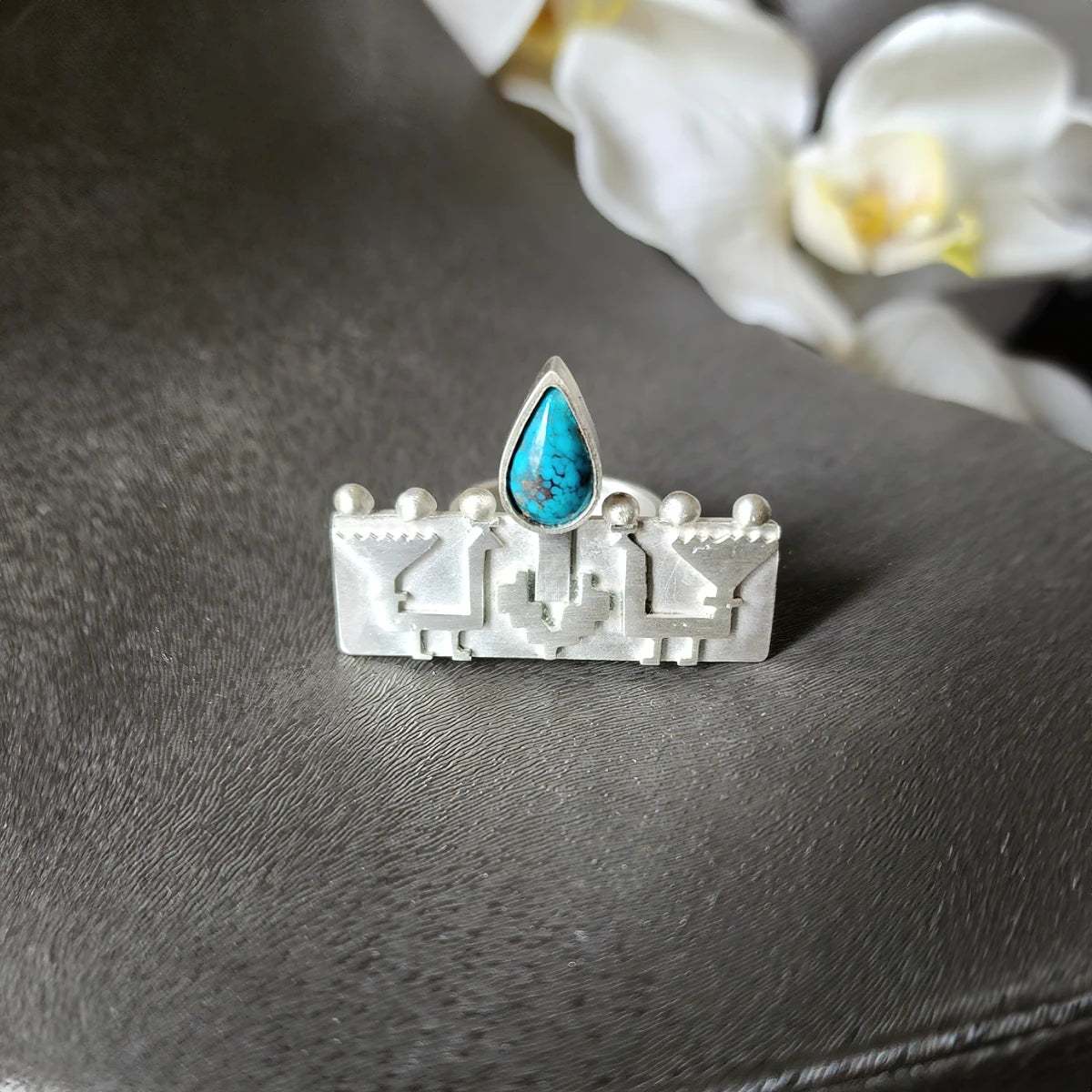 handmade silver embossed peacocks statement ring decorated with teardrop turquoise