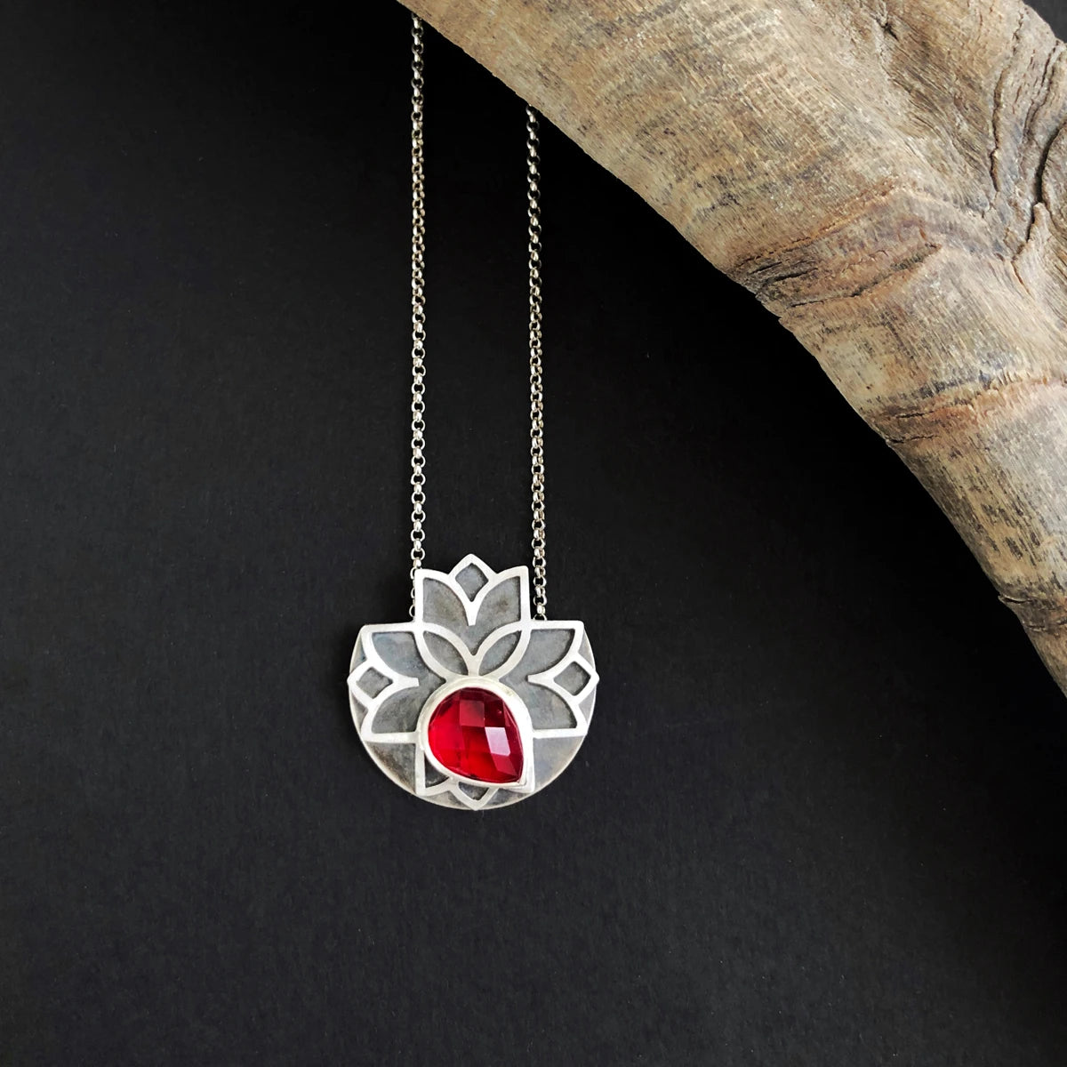 handmade silver flower necklace with teardrop red cubic zirconia in a part of circle back