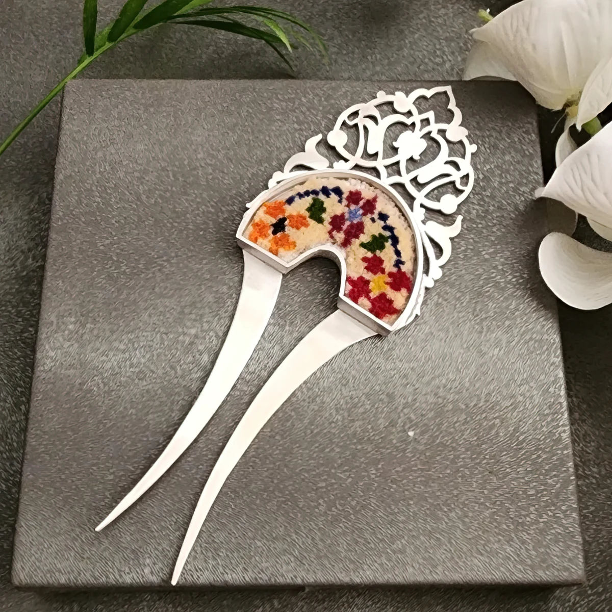 handmade silver hairpin with intricated details decorated with handwoven Persian rug
