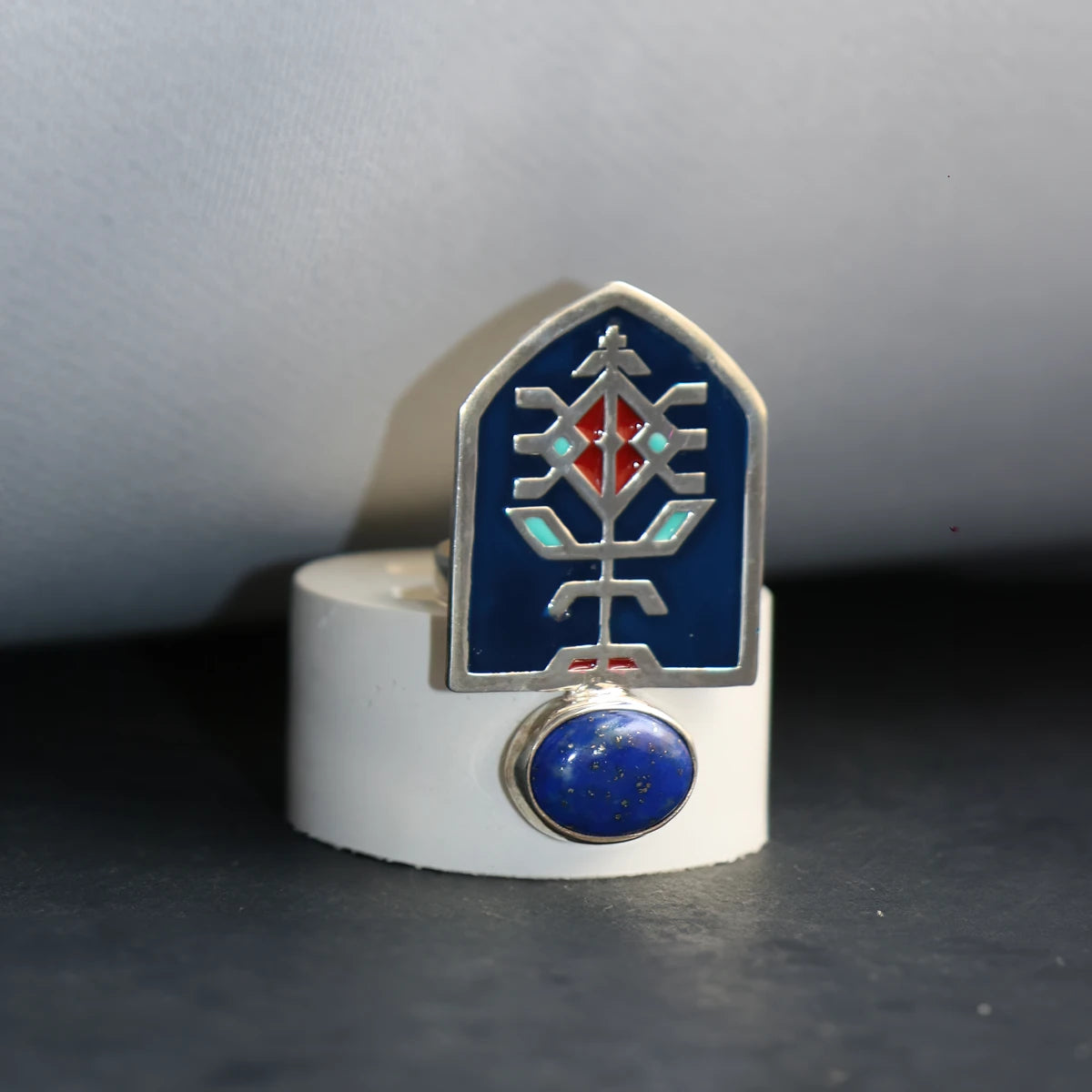 handmade silver statement ring with geometric pattern and blue and red enamel with lapis lazuli