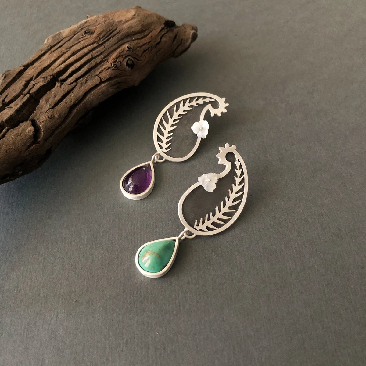 handmade silver mismatched stud earrings with amethyst, turquoise and mother of pearl