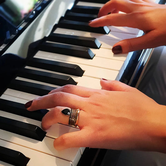 model wearing handmade silver statement ring with black cubic zirconia