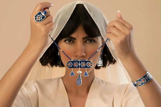 model wearing handmade enameled silver jewelry set