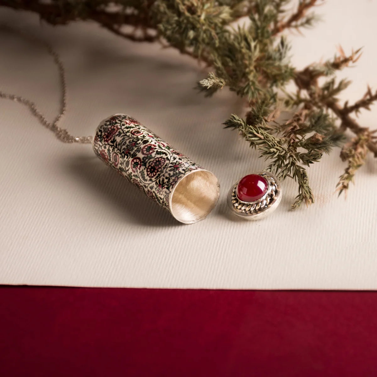 Handmade silver locket pendant necklace with a red agate covered with green and red floral pattern