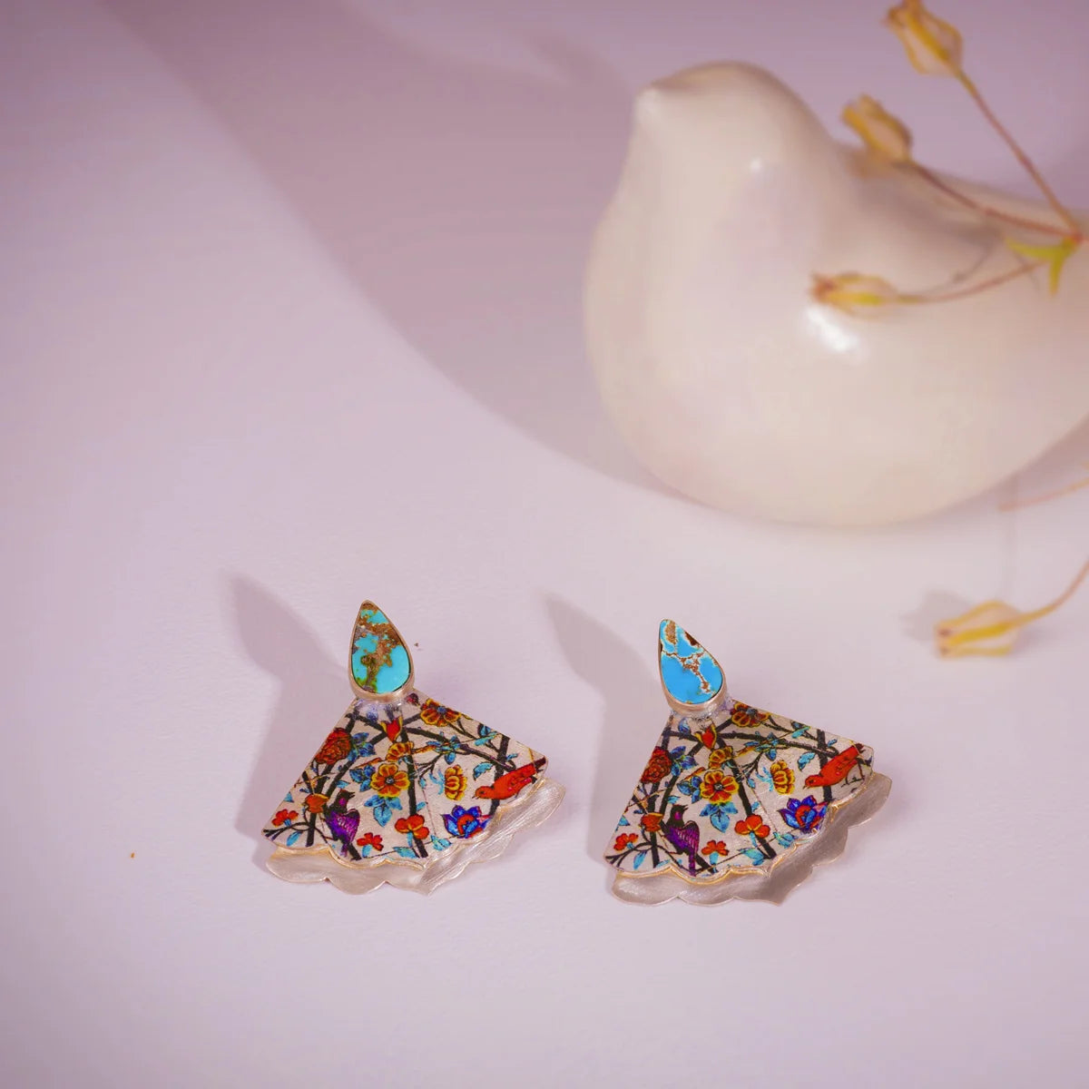 handmade silver statement earrings with turquoise and colorful patterns of birds and flowers