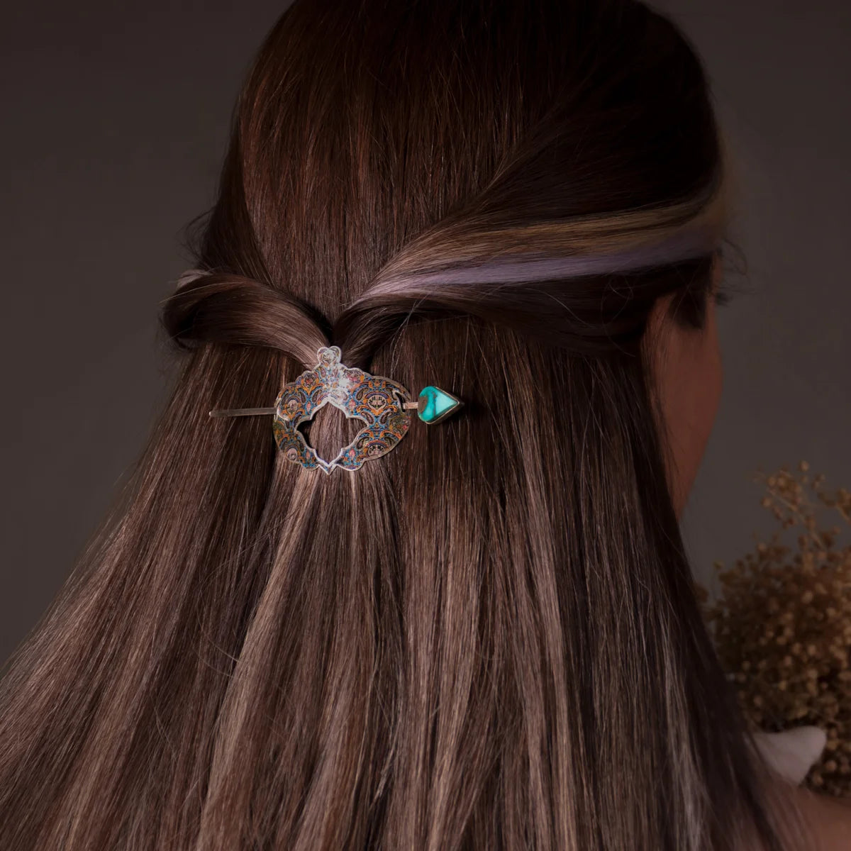 woman wearing handmade hairpin barrette with multicolored floral patterns and turquoise