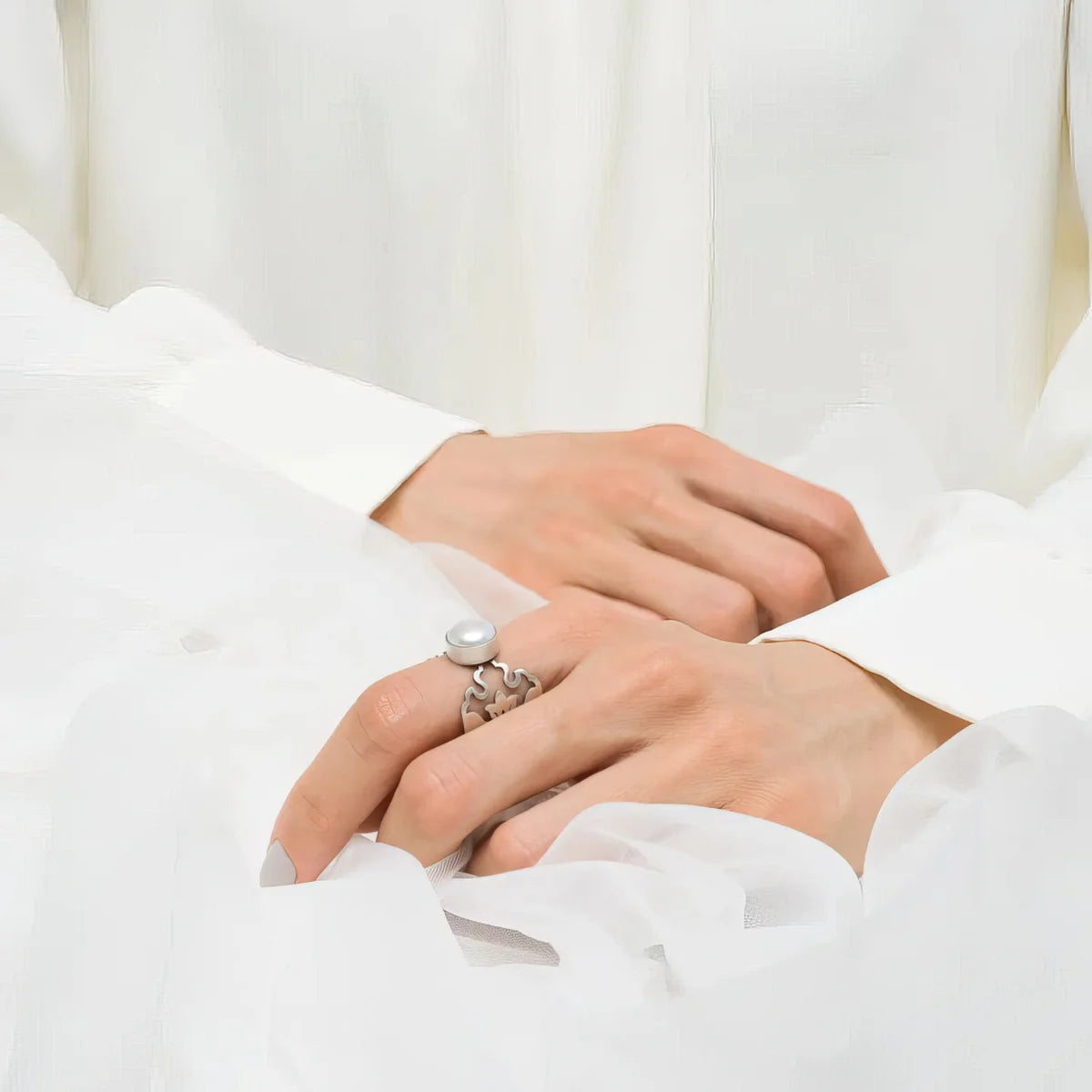 model wearing handmade silver pearl statement ring