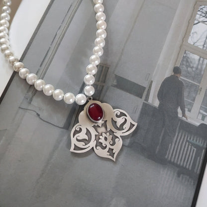 handmade oxidized silver floral pattern necklace with red agate and shells