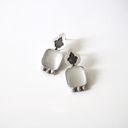 handmade silver stud earrings decorated with cat's eye gemstones