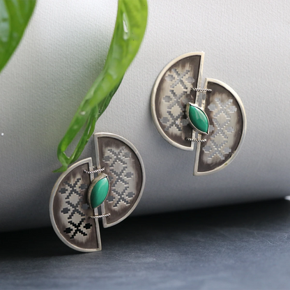 handmade openwork oxidized silver statement earrings in the shape of 2 half-circles with malachite