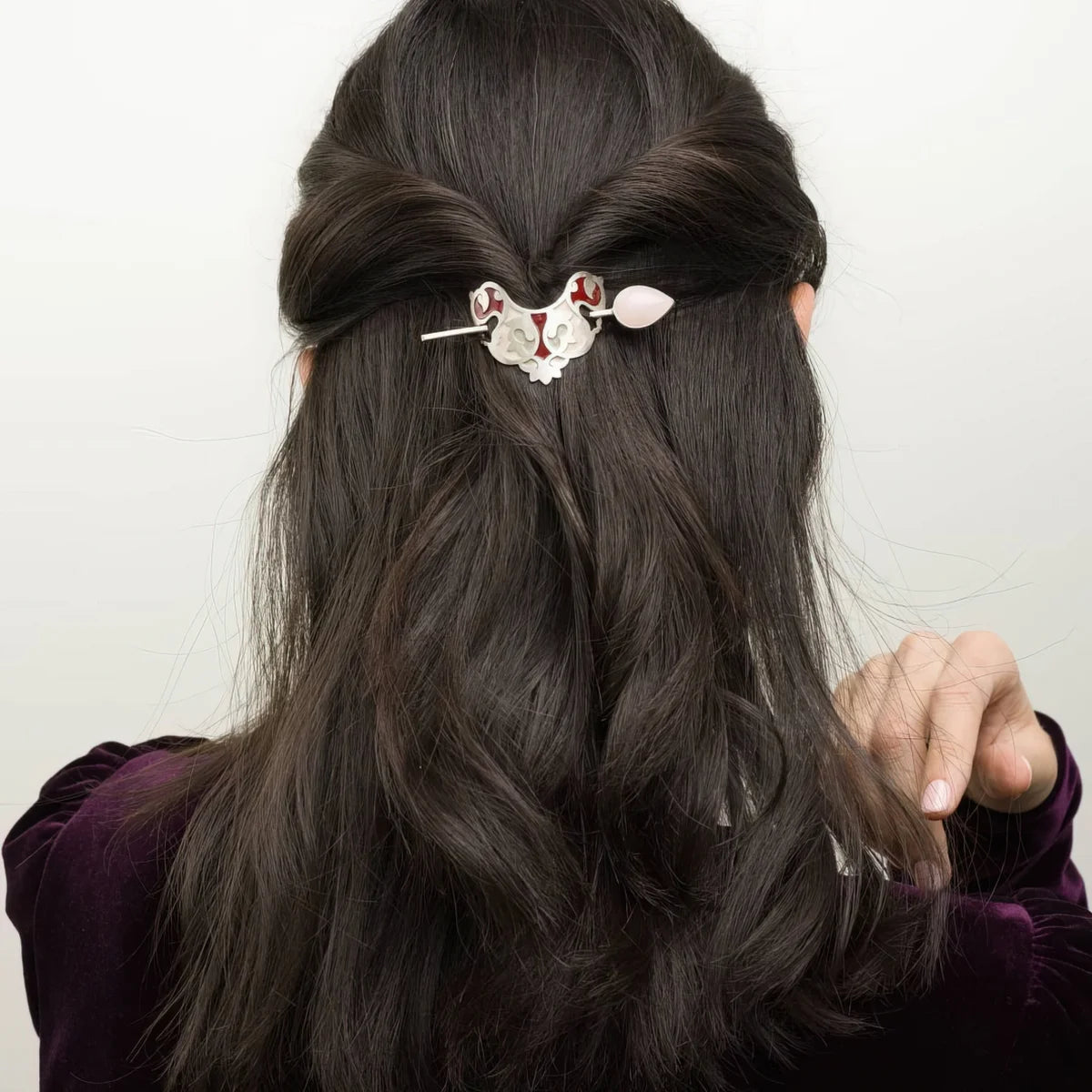 model wearing handmade silver and enamel stick barrette hair pin with rose quarts