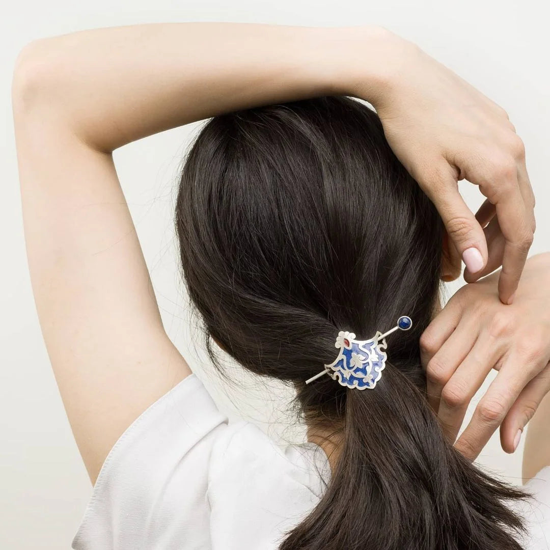 model wearing handmade silver hair stick barrette hair pin with lapis lazuli and blue and red enamel