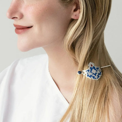 model wearing handmade silver hair stick barrette hair pin with lapis lazuli and blue and red enamel