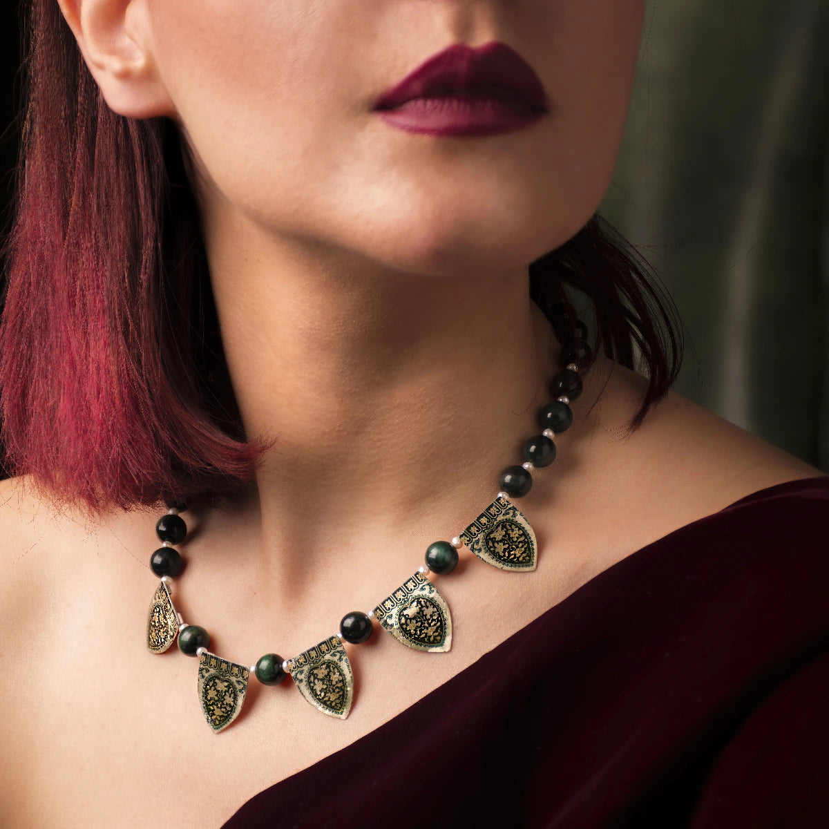 model wearing handmade silver necklace with green tiger's eye beads