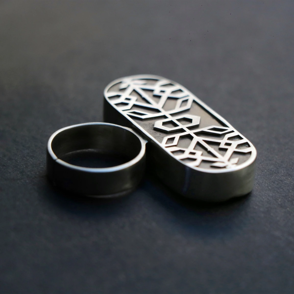 handmade oxidized silver statement ring with geometric patterns
