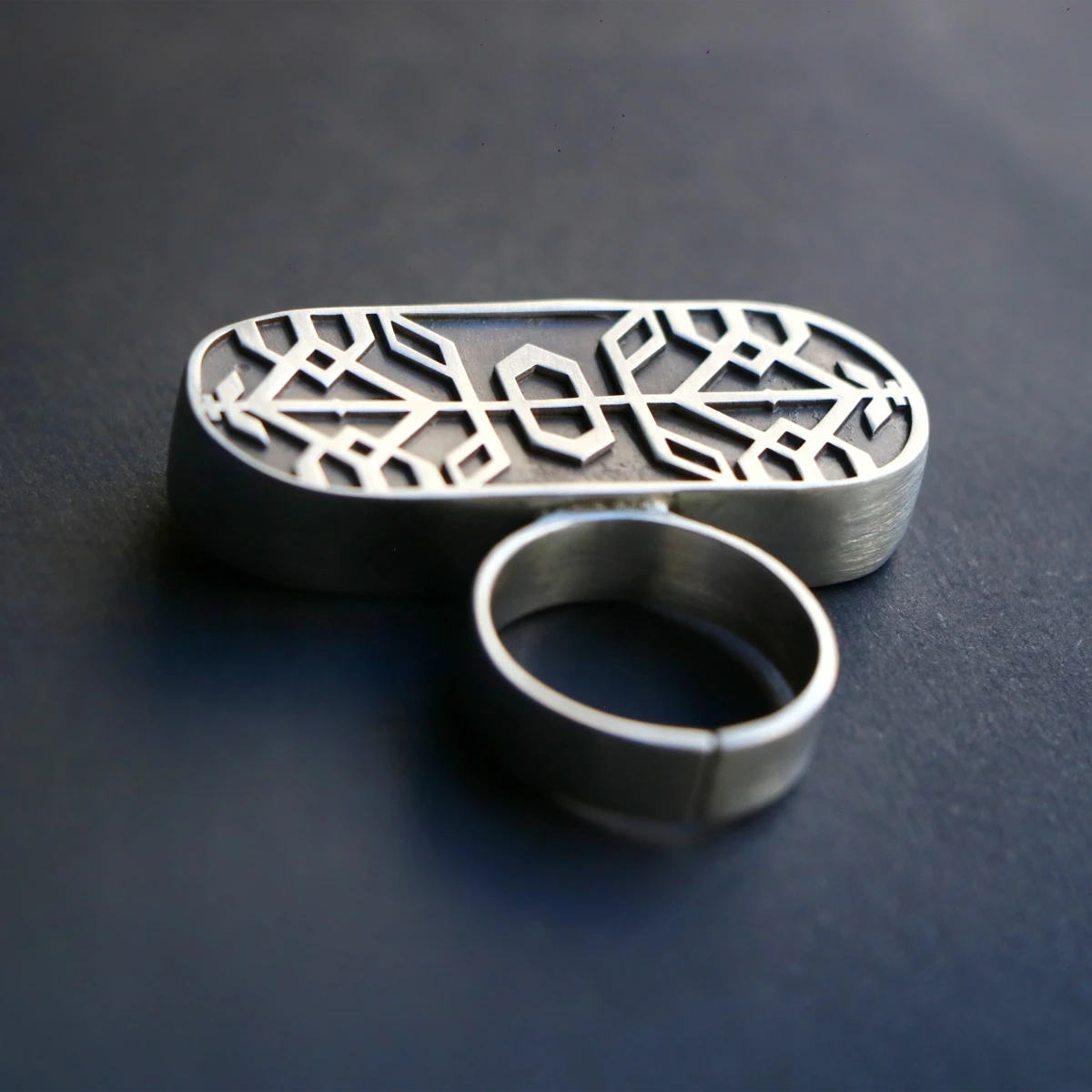 handmade oxidized silver statement ring with geometric patterns
