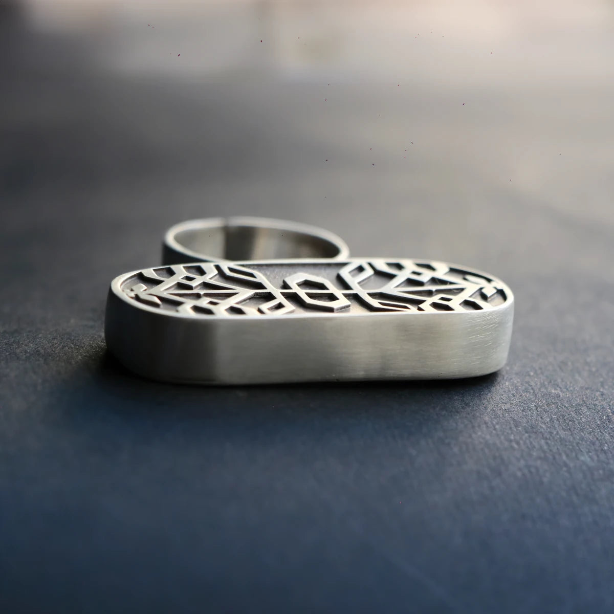 handmade oxidized silver statement ring with geometric patterns