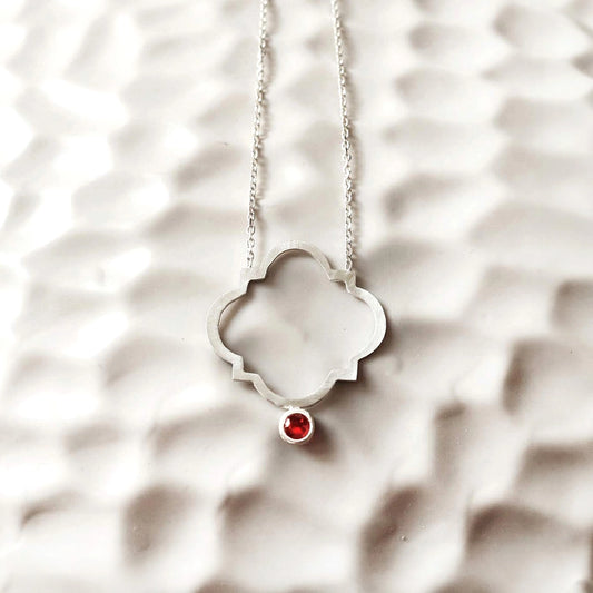 minimalist handmade silver pendant necklace with red cubic zirconia