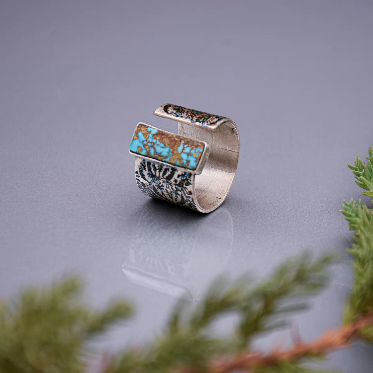 handmade silver statement ring with turquoise and floral pattern