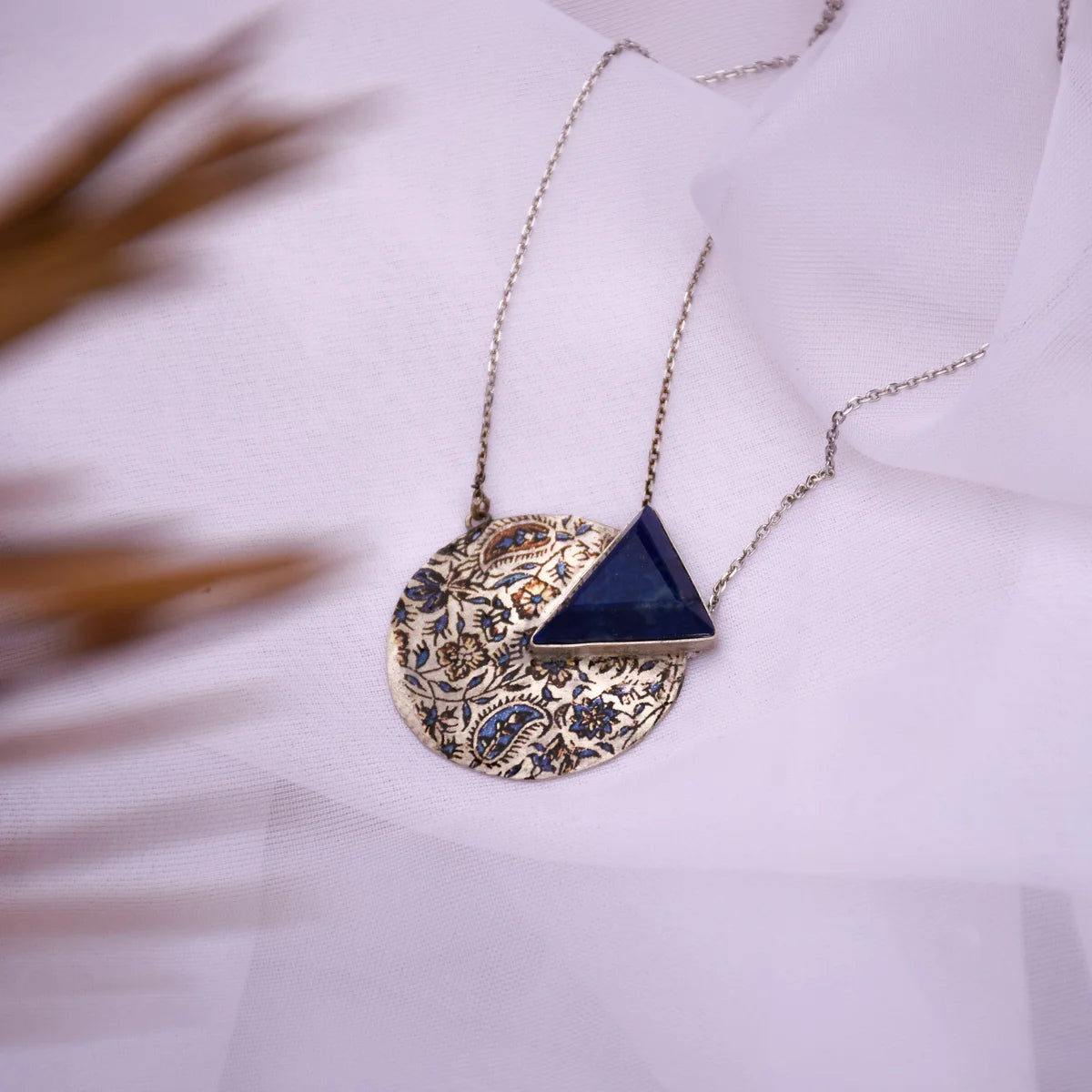 round circle handmade pendant necklace with lapis lazuli and paisley and floral patterns