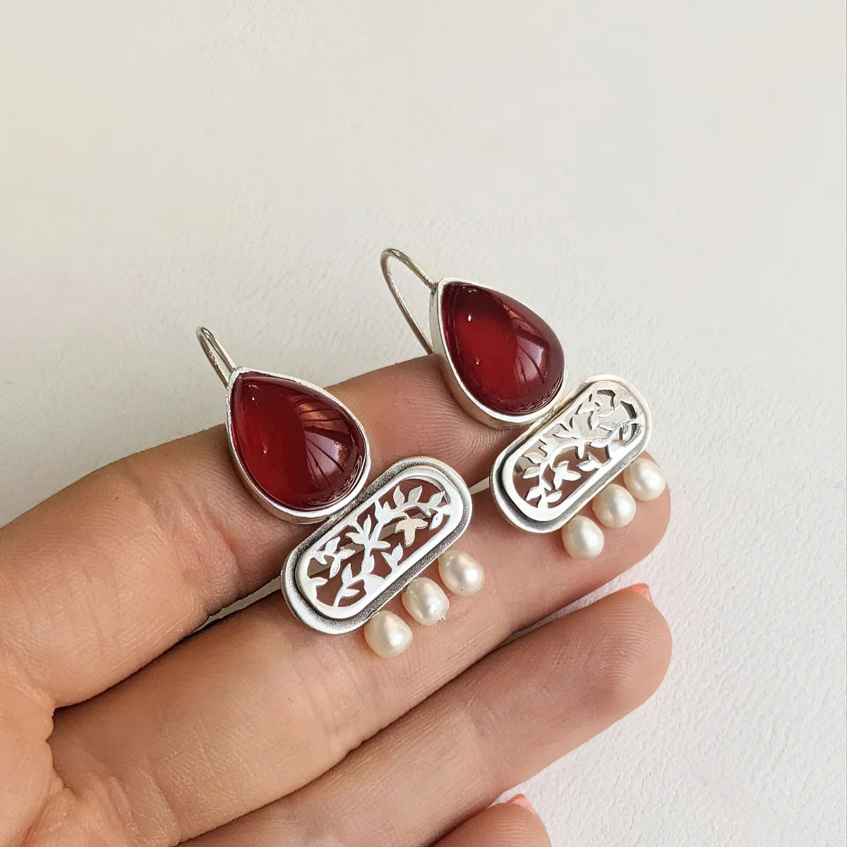 handmade statement drop silver earrings with faceted red agate and pearls