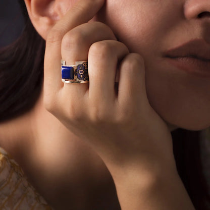 handmade statement silver ring with lapis lazuli and blue pattern worn on hand