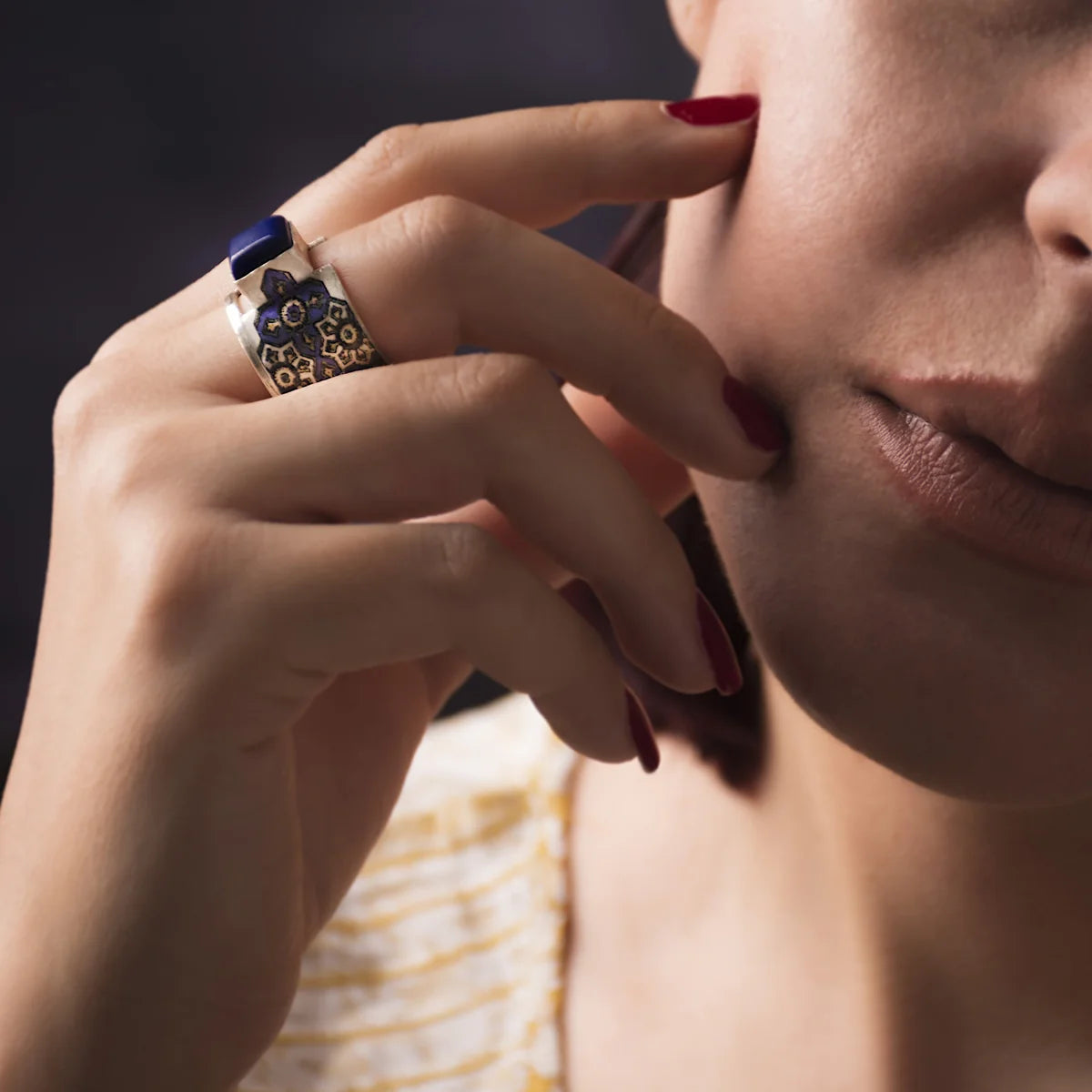 handmade statement silver ring with lapis lazuli and blue pattern worn on hand