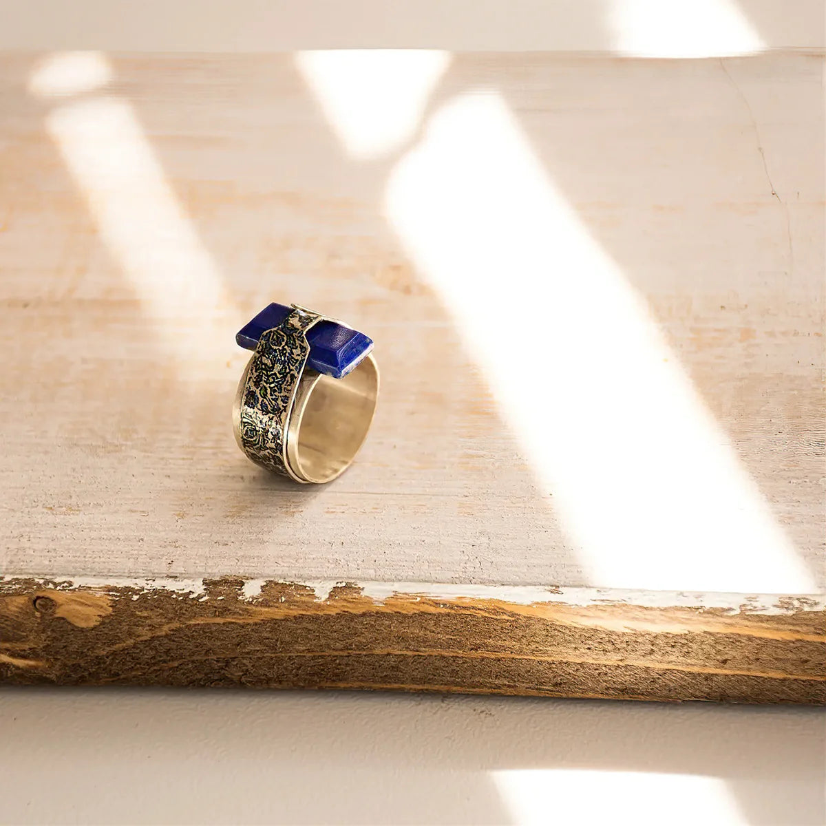 handmade silver statement ring with lapis lazuli and unique floral pattern