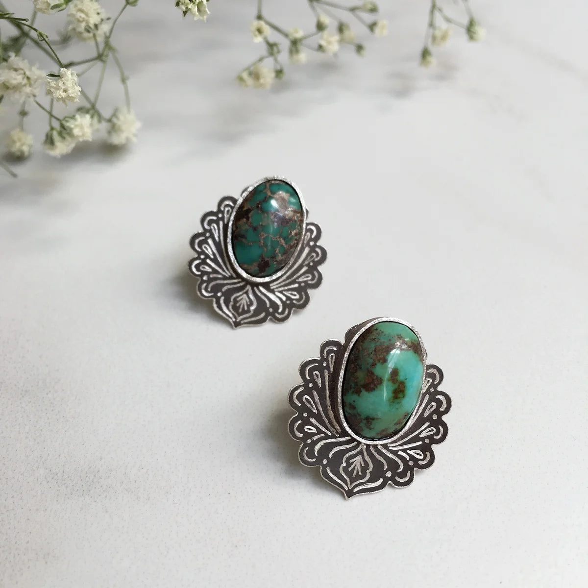 minimalistic oxidized silver stud earrings adorned with turquoise